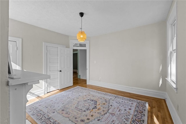 dining area featuring baseboards and wood finished floors