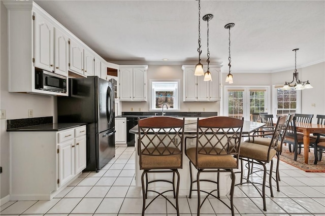 1641 Blackburn Heights Dr, Franklin Park, PA 15143 - kitchen featuring a sink, light tile patterned flooring, a kitchen island, and black appliances