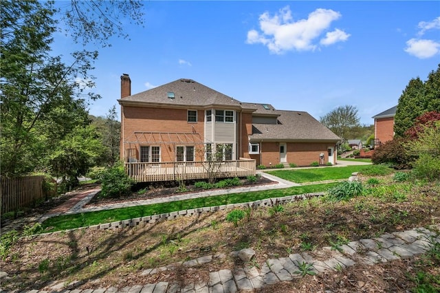 1641 Blackburn Heights Dr, Franklin Park, PA 15143 - rear view of property with fence, brick siding, a deck, a chimney, and a yard