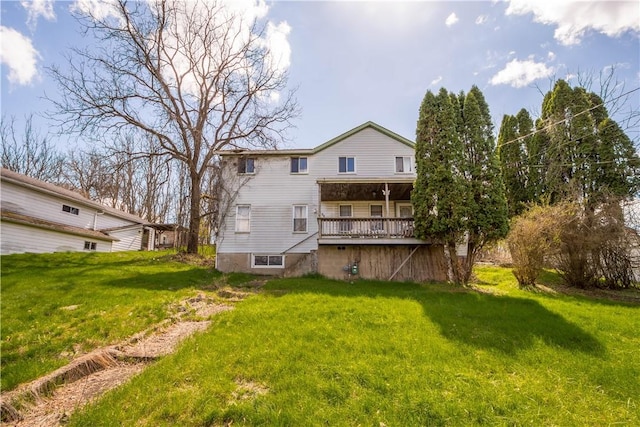 rear view of house with a yard