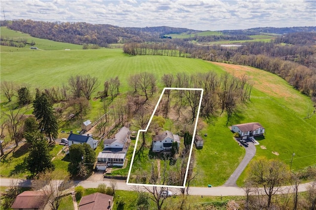 birds eye view of property featuring a rural view