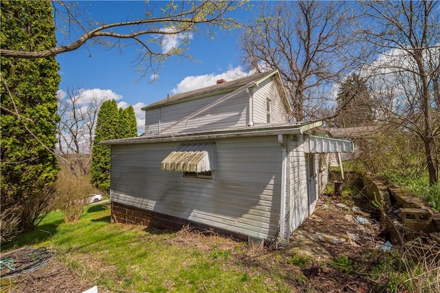 view of side of property featuring a chimney