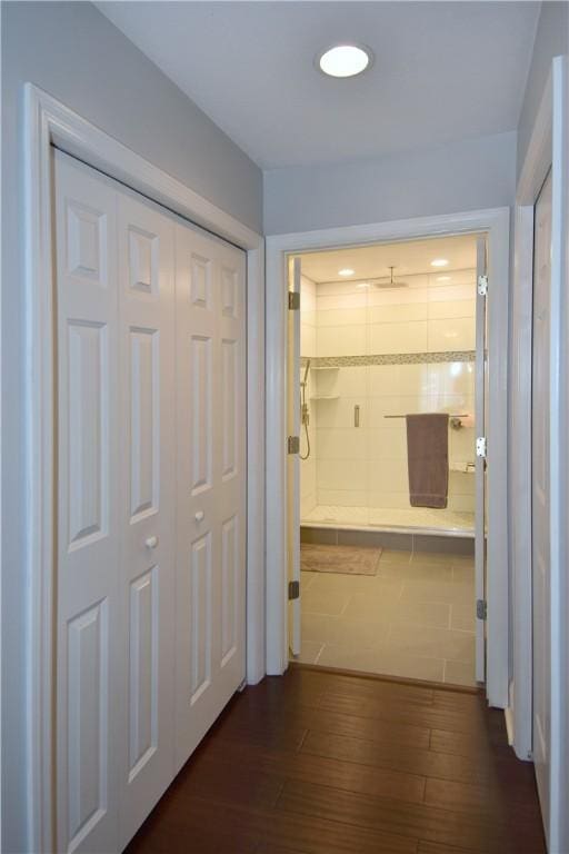 corridor featuring dark wood-style floors