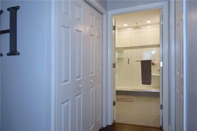 hall featuring tile patterned flooring