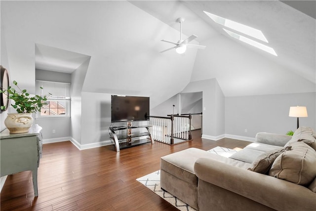 1501 Appleridge Ct, Adams Twp, PA 15044 - living area featuring a skylight, vaulted ceiling, wood finished floors, ceiling fan, and baseboards