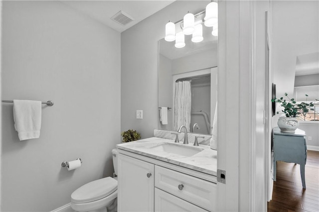 1501 Appleridge Ct, Adams Twp, PA 15044 - full bathroom featuring baseboards, toilet, vanity, and wood finished floors