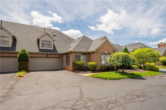 1501 Appleridge Ct, Adams Twp, PA 15044 - view of property featuring brick siding, driveway, a garage, and a shingled roof