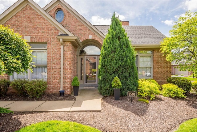 1501 Appleridge Ct, Adams Twp, PA 15044 - view of exterior entry with brick siding and a shingled roof