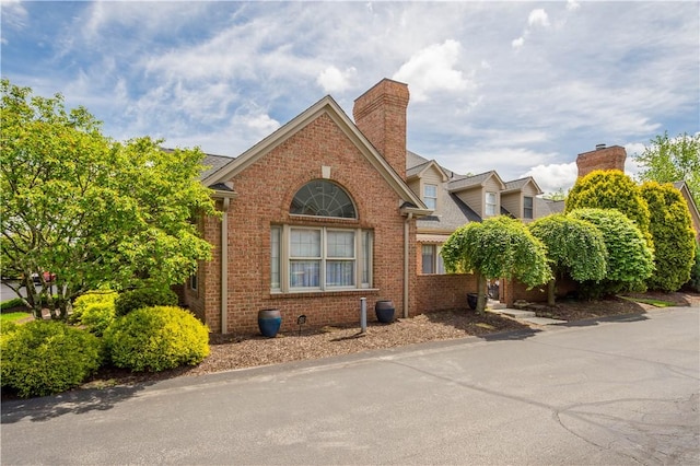 1501 Appleridge Ct, Adams Twp, PA 15044 - view of side of home featuring brick siding and a chimney