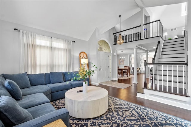1501 Appleridge Ct, Adams Twp, PA 15044 - living room featuring wood finished floors, stairway, high vaulted ceiling, baseboards, and a chandelier