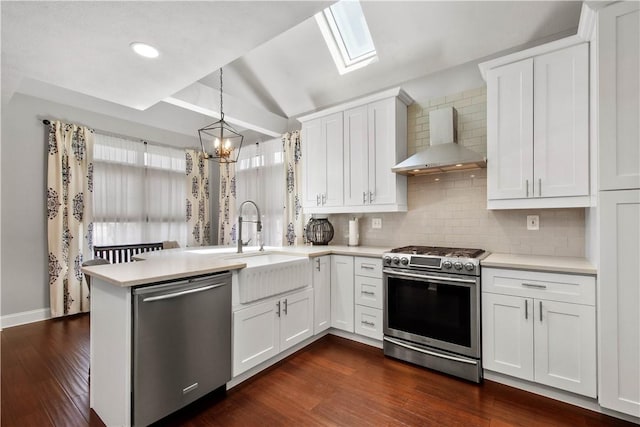 1501 Appleridge Ct, Adams Twp, PA 15044 - kitchen with stainless steel appliances, wall chimney range hood, light countertops, a sink, and a peninsula