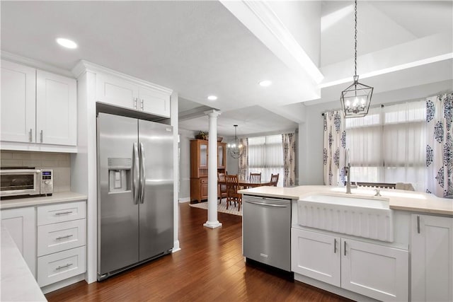 1501 Appleridge Ct, Adams Twp, PA 15044 - kitchen with stainless steel appliances, a chandelier, light countertops, white cabinetry, and a sink