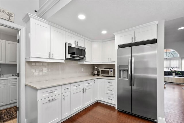1501 Appleridge Ct, Adams Twp, PA 15044 - kitchen featuring appliances with stainless steel finishes, light countertops, white cabinets, dark wood-style flooring, and tasteful backsplash