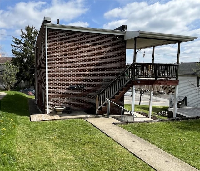 338 Prestley Rd, Bridgeville, PA 15017 - rear view of property with a lawn, stairs, a deck, and brick siding