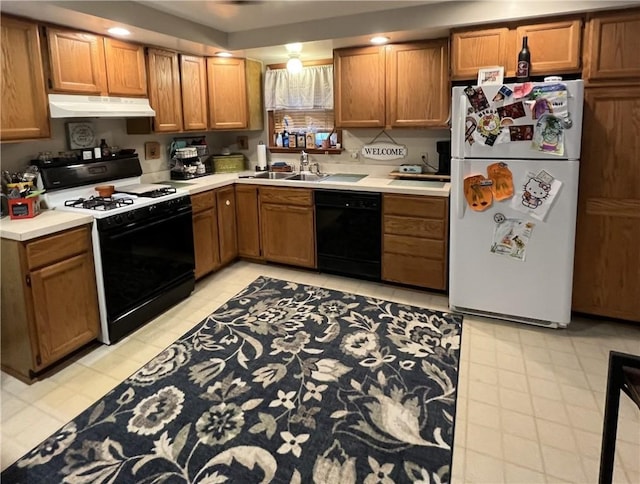 338 Prestley Rd, Bridgeville, PA 15017 - kitchen with a sink, dishwasher, freestanding refrigerator, gas range, and under cabinet range hood