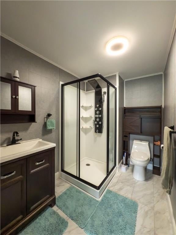 bathroom featuring toilet, ornamental molding, marble finish floor, and a stall shower