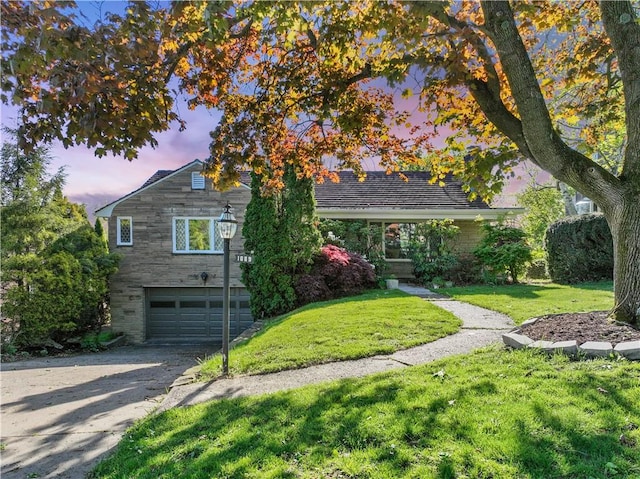 1089 Firwood Dr, Mt Lebanon, PA 15243 - view of front facade featuring a lawn, an attached garage, and aphalt driveway