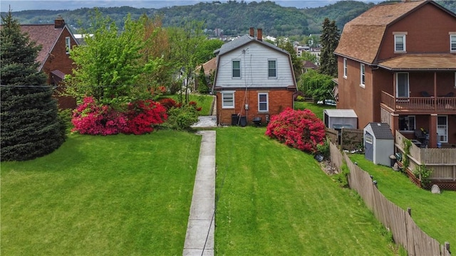 exterior space featuring fence and a mountain view