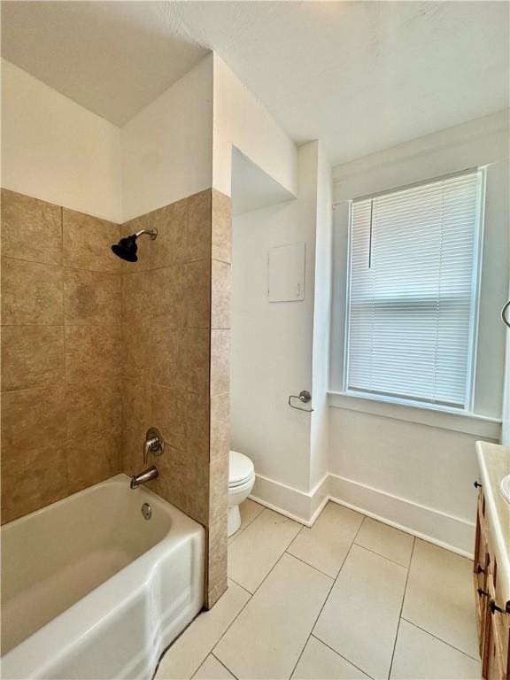full bathroom featuring tile patterned flooring, vanity, toilet, baseboards, and shower / washtub combination