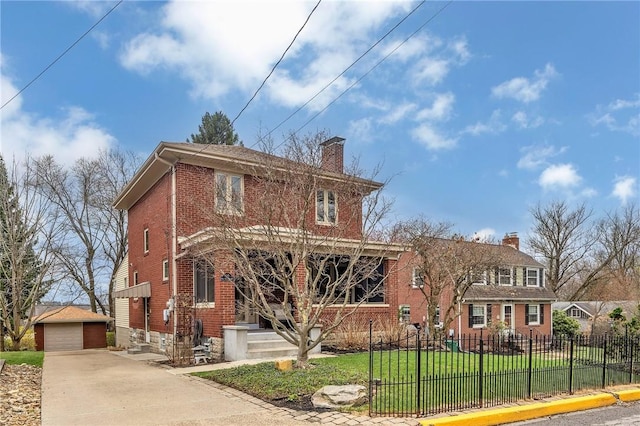 view of front of home with an outdoor structure, fence, a front yard, a chimney, and brick siding
