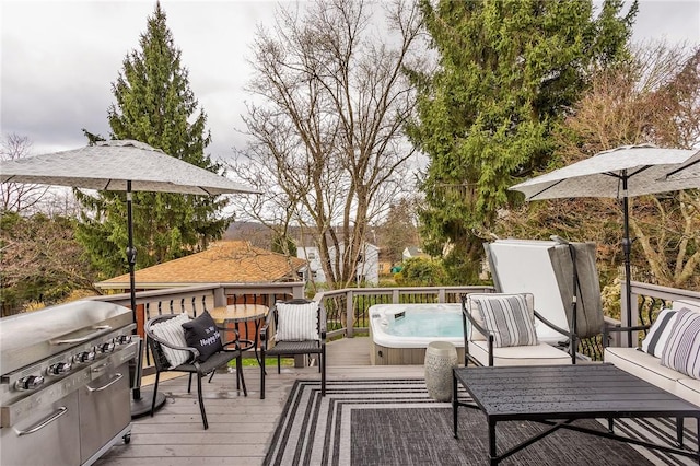 deck featuring a covered hot tub and a grill