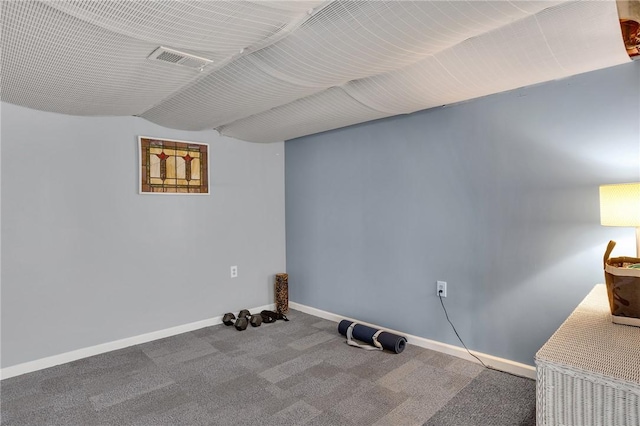 interior space with baseboards and visible vents