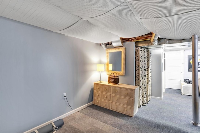 carpeted bedroom featuring baseboards