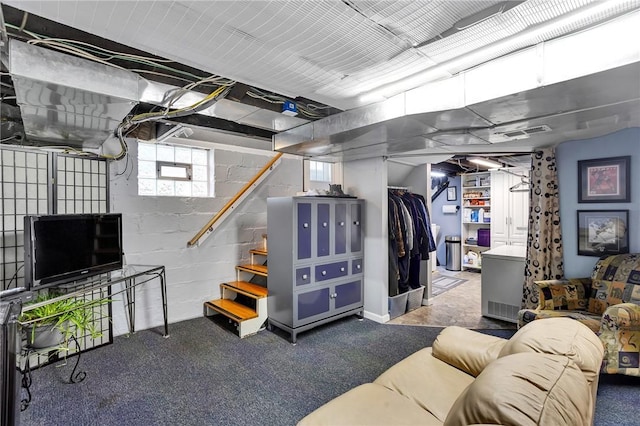 below grade area featuring visible vents and concrete block wall