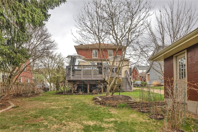 view of yard featuring stairs and a deck