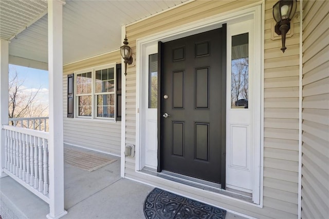 doorway to property featuring a porch