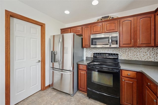 kitchen featuring backsplash, appliances with stainless steel finishes, and brown cabinetry