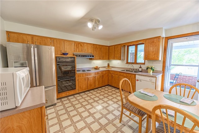 500 11th St, Oakmont, PA 15139 - kitchen featuring range hood, a sink, light countertops, light floors, and white appliances