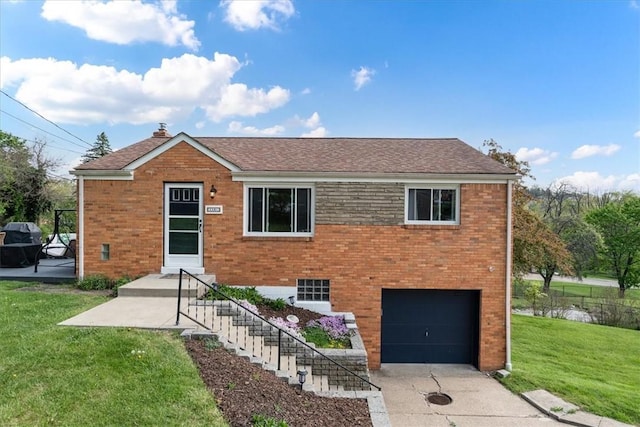 3381 Wallace Dr, Baldwin Boro, PA 15227 - view of front of home with an attached garage, brick siding, driveway, and a front lawn