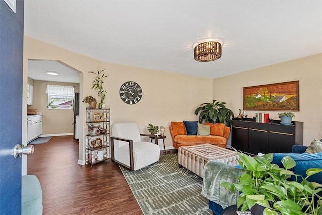 3381 Wallace Dr, Baldwin Boro, PA 15227 - living area with arched walkways, baseboards, and dark wood-style floors