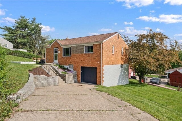 3381 Wallace Dr, Baldwin Boro, PA 15227 - view of front of property with driveway, brick siding, an attached garage, and a front yard