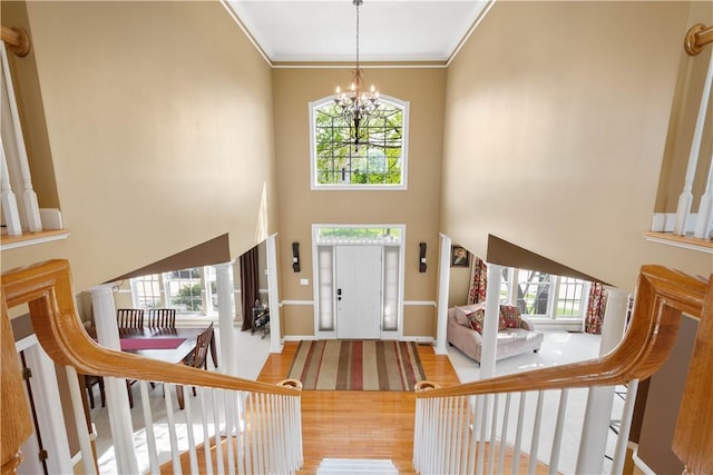 342 Buffalo Ridge Rd, Peters Twp, PA 15317 - foyer featuring a high ceiling, an inviting chandelier, plenty of natural light, and wood finished floors