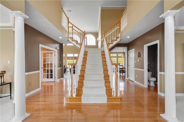 342 Buffalo Ridge Rd, Peters Twp, PA 15317 - stairs featuring ornate columns, baseboards, visible vents, and wood finished floors