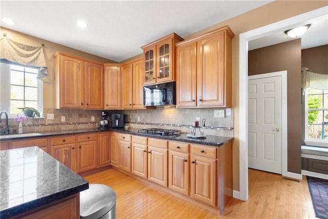 342 Buffalo Ridge Rd, Peters Twp, PA 15317 - kitchen featuring black microwave, a sink, light wood finished floors, stainless steel gas cooktop, and dark stone counters