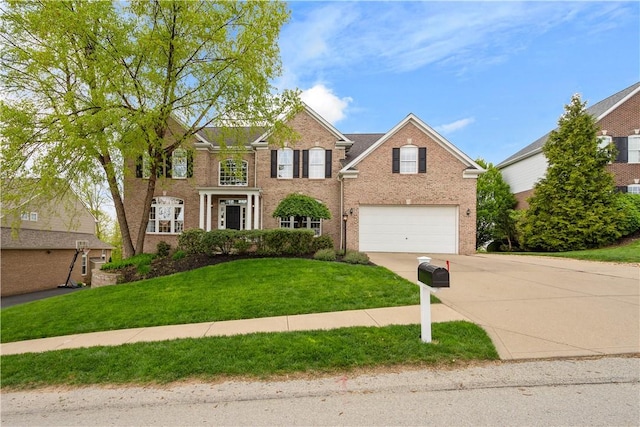 342 Buffalo Ridge Rd, Peters Twp, PA 15317 - view of front of house featuring a garage, concrete driveway, a front lawn, and brick siding