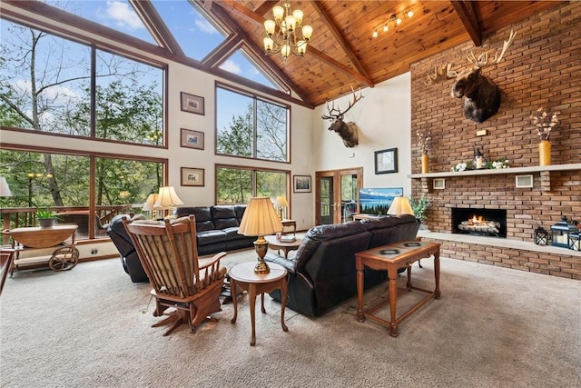 209 Claypoole Hill Rd, Bethel Twp, PA 16226 - carpeted living room featuring a brick fireplace, beam ceiling, high vaulted ceiling, a chandelier, and wooden ceiling
