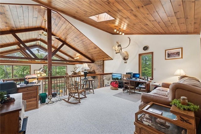 209 Claypoole Hill Rd, Bethel Twp, PA 16226 - carpeted living area featuring vaulted ceiling with skylight, wooden ceiling, and plenty of natural light