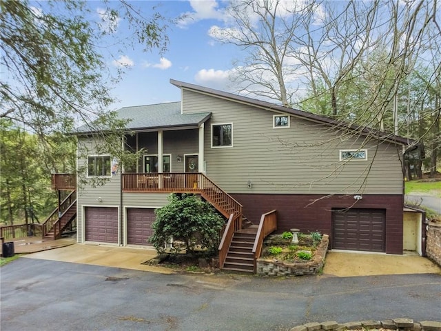 209 Claypoole Hill Rd, Bethel Twp, PA 16226 - view of front facade featuring roof with shingles, an attached garage, stairway, and aphalt driveway