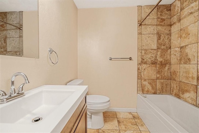 full bathroom with vanity, baseboards, bathing tub / shower combination, and toilet