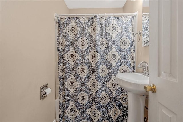 full bathroom with a shower with shower curtain