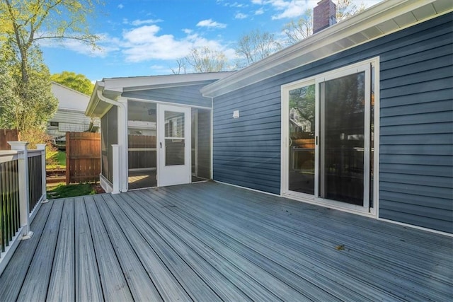 wooden terrace featuring a sunroom