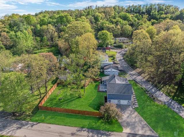 aerial view featuring a wooded view