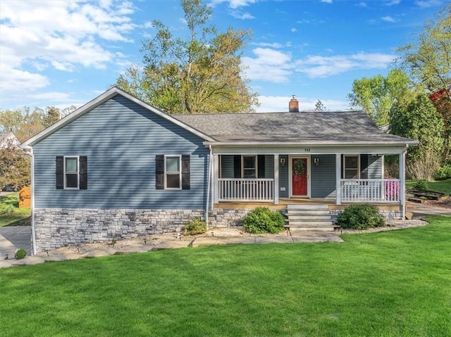 single story home with covered porch, a chimney, and a front yard