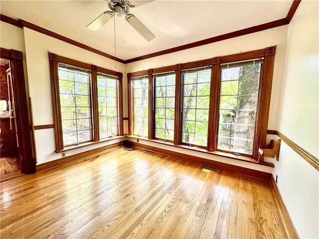 1214 Chislett St, Morningside, PA 15206 - unfurnished room with visible vents, crown molding, wood finished floors, baseboards, and a ceiling fan