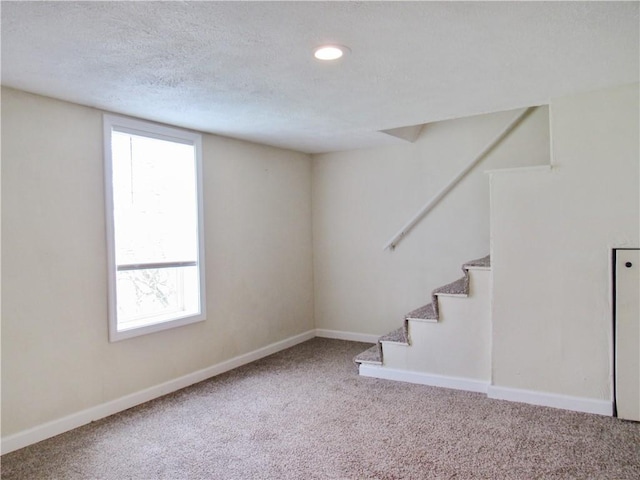 776 W Vine St, Mount Pleasant Boro, PA 15666 - basement with stairway, baseboards, carpet, and a textured ceiling