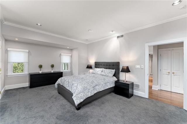 bedroom featuring crown molding, carpet, and visible vents